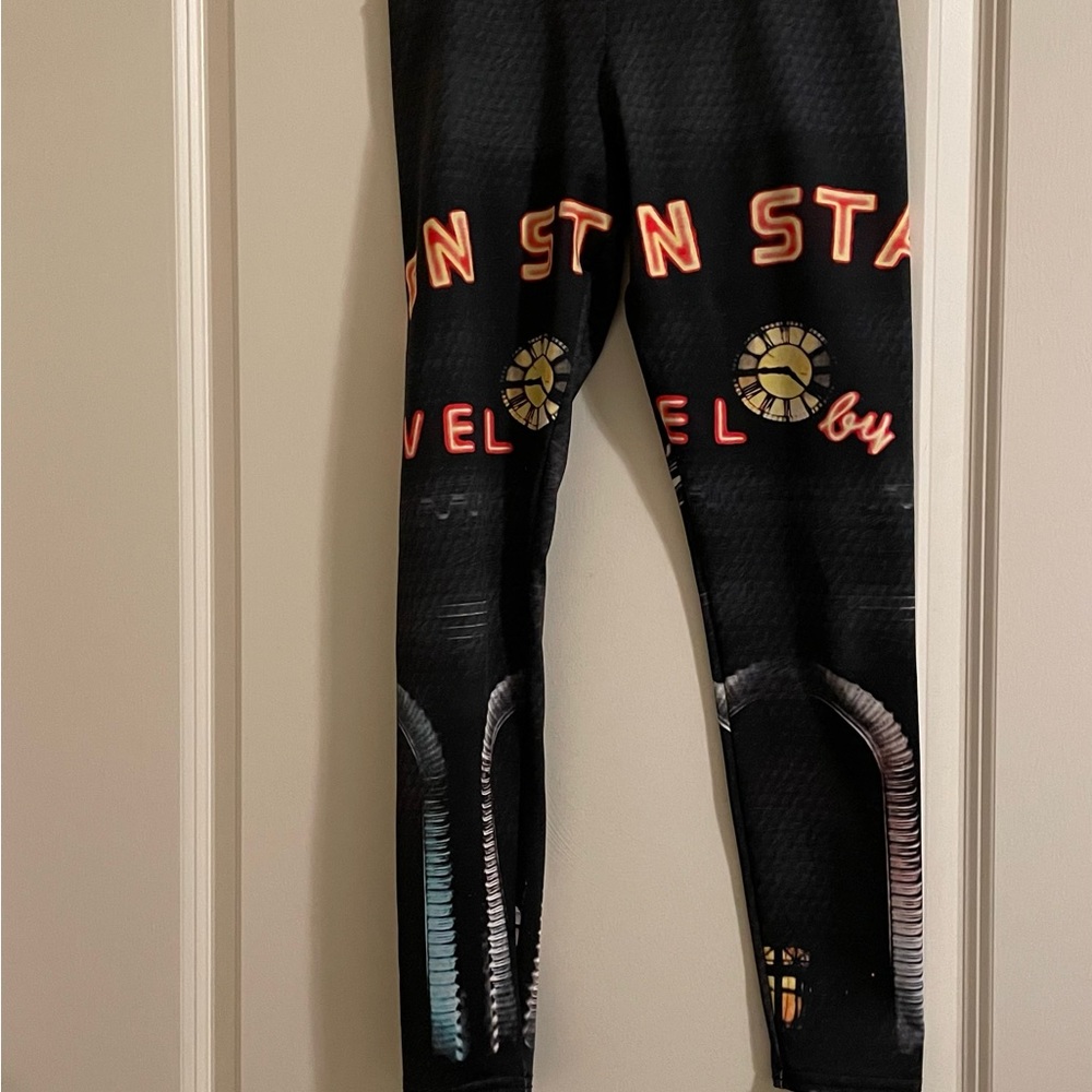 Mellivora leggings xs with union station printed on them.